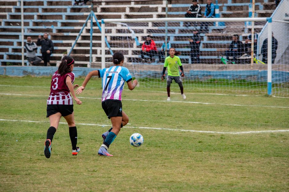 Action-packed women's soccer match with players competing on the field.