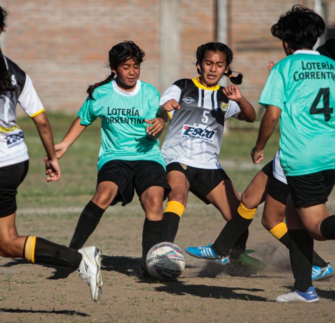 Young soccer players in action during a dynamic outdoor match.